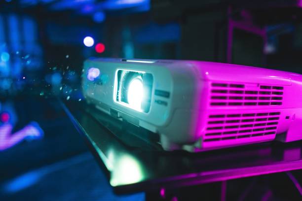istock Closeup of a projector under the colorful lights with a blurry background 1439458730