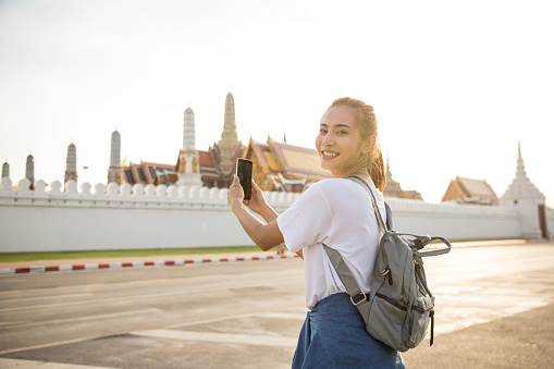Asian female backpacker travel in bangkok