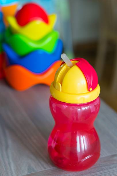 istock Vertical image of a pink sippy tumbler with straw 1439459755