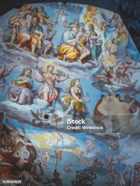Vertical Shot Of Religious Painting On The Wall In Florence Italy Stock Photo - Download Image Now