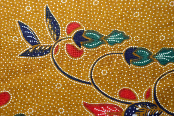 istock Ocher color based Batik fabric with oriental floral texture. 1439459847