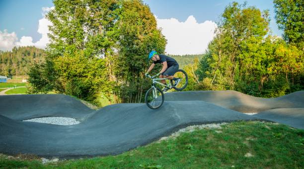 istock Professional cyclist performing tricks on an asphalt bike course 1439460769