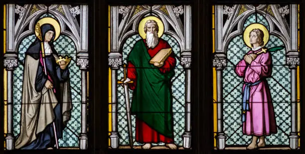 A Stained Glass window in St. Vitus Cathedral depicting Saint Gisela, Saint Paul, and Saint Rudolph