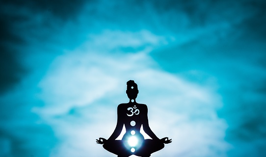 An illustration of a figure showing chakras - The color Blue shows the Throat chakra