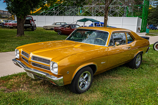 Des Moines, IA - July 01, 2022: High perspective front corner view of a 1972 Pontiac Ventura II Coupe at a local car show.