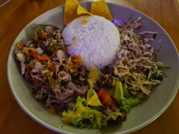 istock a plate of white rice complete with side dishes on a table and ready to eat 1439464472