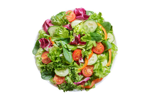 istock plate of salad with fresh vegetables on white background, top view 1439466563