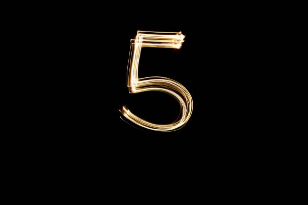 istock Light painting number 5 on black background 1439471780