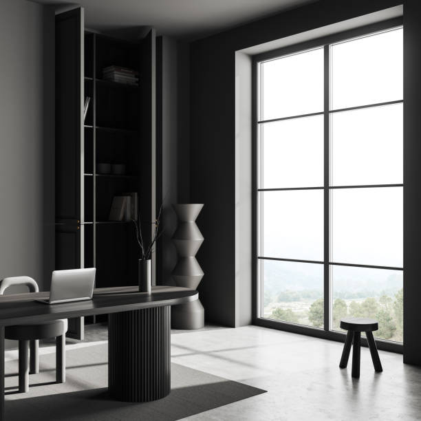 istock Grey office room interior with desk and computer and panoramic window 1439472978