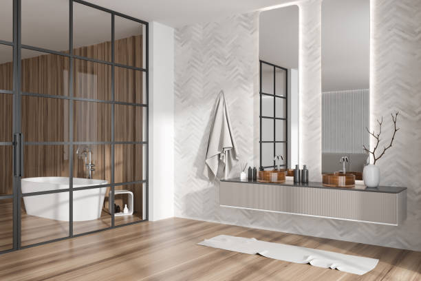 istock Elegant bathroom interior with bathtub, two washbasins and bath accessories 1439473110
