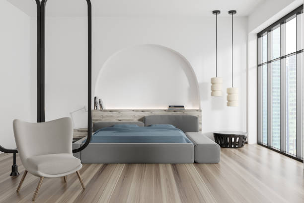 istock Light bedroom interior with bed, armchair and panoramic window 1439474416