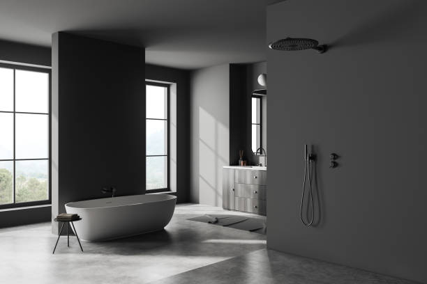 istock Grey bathroom interior with bathtub and shower, window. Mockup empty wall 1439474765