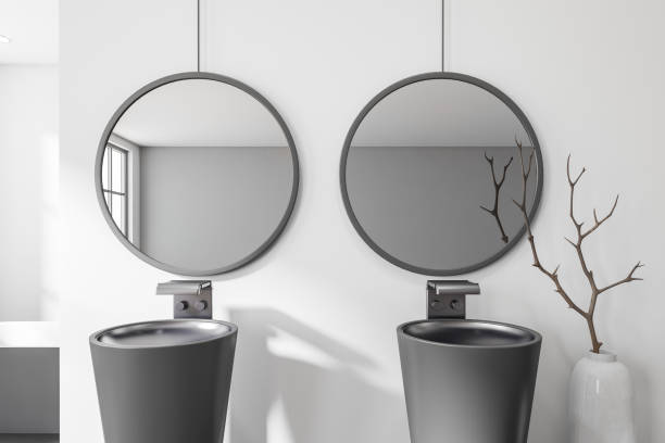 istock Stylish bathroom interior with double sink and mirrors 1439475072