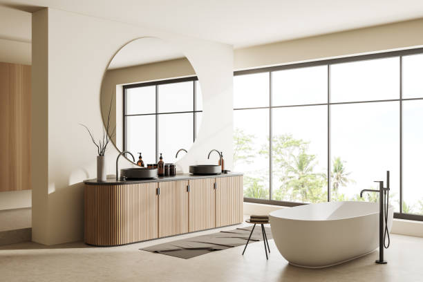 istock Corner view on bright bathroom interior with bathtub, panoramic window 1439475488