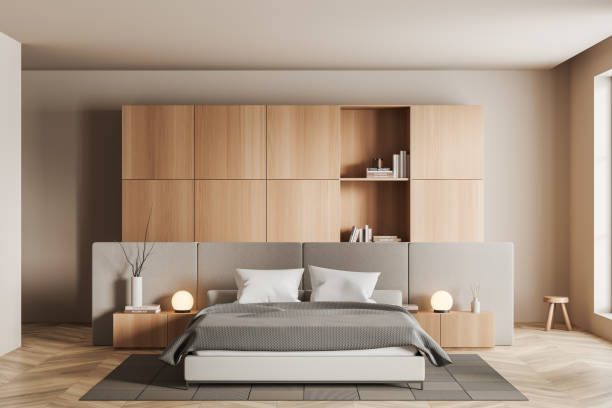 istock Stylish bedroom interior with bed and shelf with decoration 1439476513