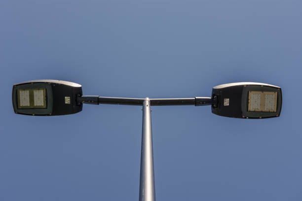 Detailed LED panels on a street light split in two opposite ways for illumination on both lanes on a highway