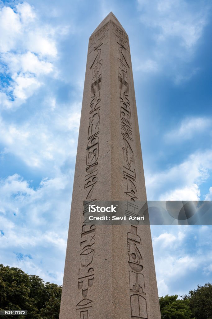Side view of Obelisk from Egypt to Sultan Ahmet Square Istanbul, Turkey-August 10, 2022: Side view of Obelisk from Egypt to Sultan Ahmet Square. There are hieroglyphic inscriptions on the obelisk. Shot with Canon EOS R5. Ancient Stock Photo