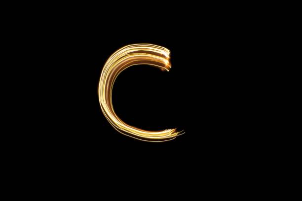 istock Light painting letter C on black background 1439477742