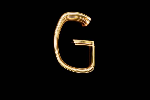 istock Light painting letter G on black background 1439477772