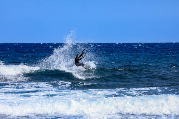 Salary, Madagascar, June 6, 2017: A kitesurfer surfing in the Ambatomilo lagoon, South of Madagascar