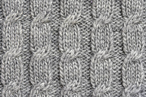 istock Grey knitted wool texture. braided knitted fabric. 1439482347