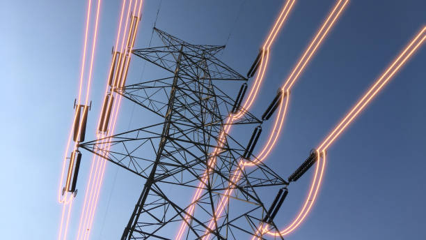 istock Electricity transmission towers with glowing wires 1439482487