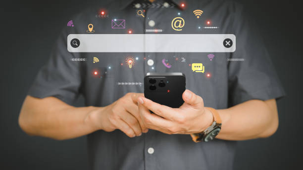 istock Man using a mobile phone in the room for searching browsing internet data information. Business concept for smartphone using search with your website. 1439488709