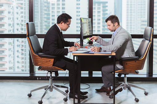 two business man join working discussion together. executive talking consult with manager at office desk.