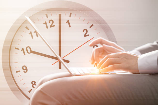 istock business work on time fast speed working concept. hand typing on laptop computer against times clock face for office hours morning. 1439489119