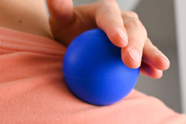 istock Close-up of a person using a massage ball roller 1439495266