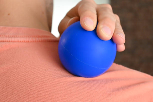 istock Close-up of a person using a massage ball roller 1439495272
