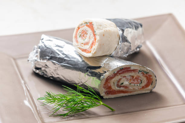 tortilla filled with smoked salmon and dill cream cheese stock photo