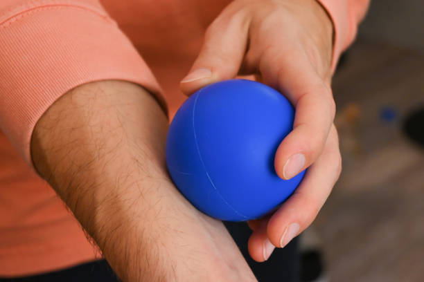 istock Close-up of a person using a massage ball roller 1439495295