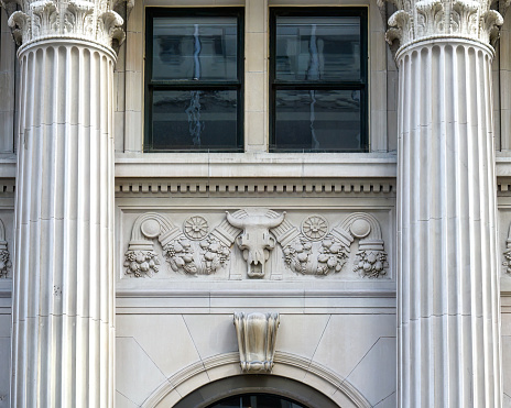 Architecture detail in Yonge St. Close-up of a building's exterior with columns in Toronto, Canada