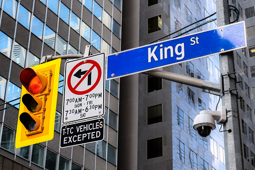 Direction sign on King St., a street corner in Toronto, Canada