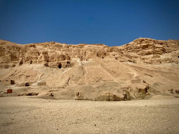Mountains around the Mortuary Temple of Hatshepsut in Luxor, Egypt The Temple was built to commemorate the achievements of the great Queen Hatshepsut (18th Dynasty), and as a funerary Temple for her, as well as a sanctuary of the god, Amon Ra. luxor thebes stock pictures, royalty-free photos & images