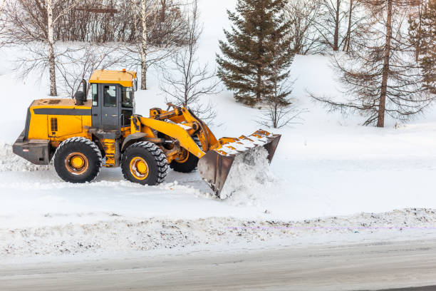 istock Snow clearing. Tractor clears the way after heavy snowfall. 1439500119