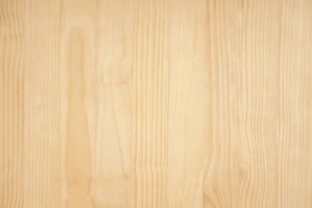 istock clean natural beige pine wooden wall board abstract pattern texture surface with space background.natural material construction wallpaper concept,product mockup backdrop,vintage retro cover design. 1439500939