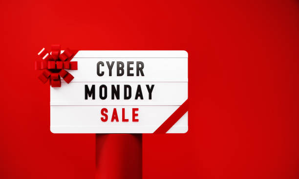 istock Cyber Monday Sale Written White Lightbox Sitting On Red Podium Before Red Background 1439503765