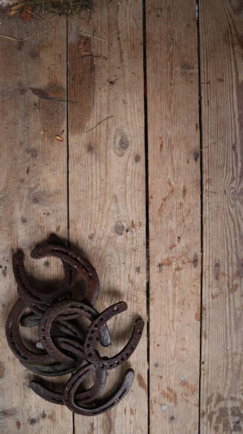 istock Horseshoes on a worn wooden surface 1439503867