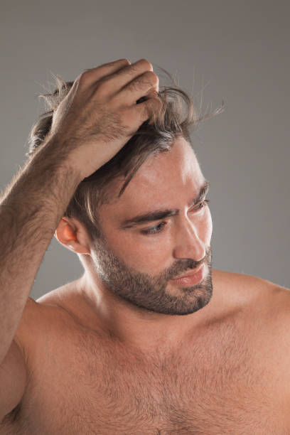 istock Man touch perfect neat hairstyle 1439503953