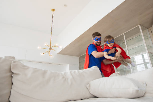 istock Father and son play superhero 1439505931