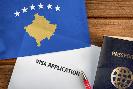 Visa application form, passport and flag of Kosovo