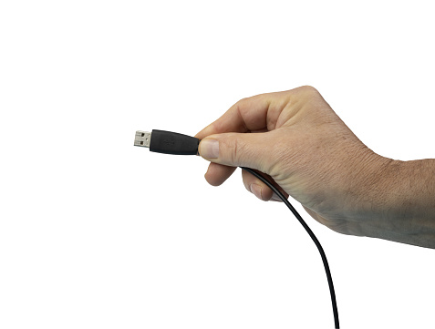 a male hand with a USB plug in his hand  on a transparent background