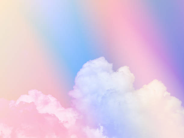 istock colorful with fluffy clouds on sky. multi color rainbow image. abstract fantasy growing light 1439511393