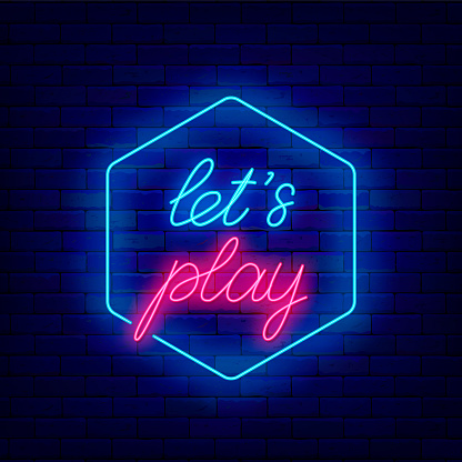 Lets play neon lettering on brick wall. Handwritten inscription. Game design. Virtual reality play. Shiny banner. Vector stock illustration