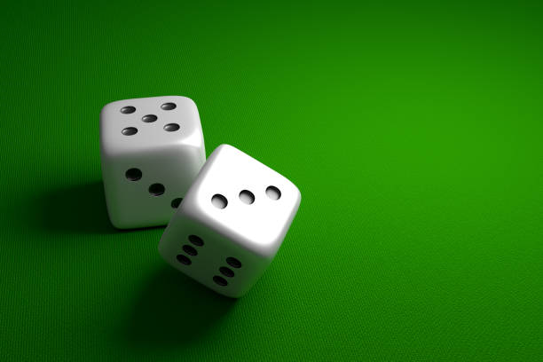 istock Rolling dice on green baize. Gambling or casino concept 3D rendering. 1439513354