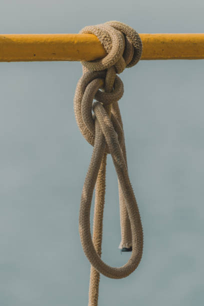 istock Old rope tied to a knot 1439513562