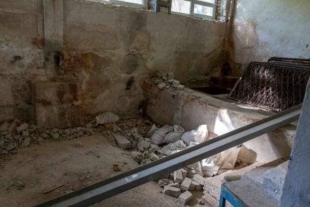 istock Broken floor, trash and clutter in an abandoned room 1439514919