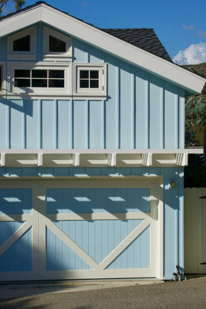 istock Farmhouse style beach cottage with white trim 1439515436